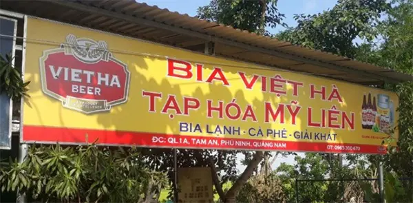bảng hiệu nền vàng chữ đỏ